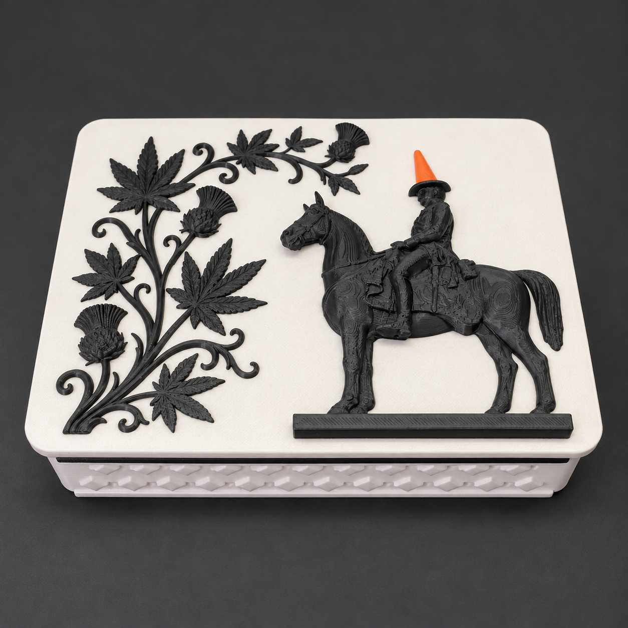 It's a Glasgow Thing tray — Glasgow’s cone-topped statue with decorative leaf detail.